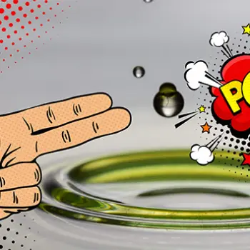 Comic-Hand und „POW!“-Blase neben einem Tropfen, der in eine grünliche Flüssigkeit fällt – Symbolbild für die Wirkung von Spezialschmierstoffen in besonderen Anwendungen